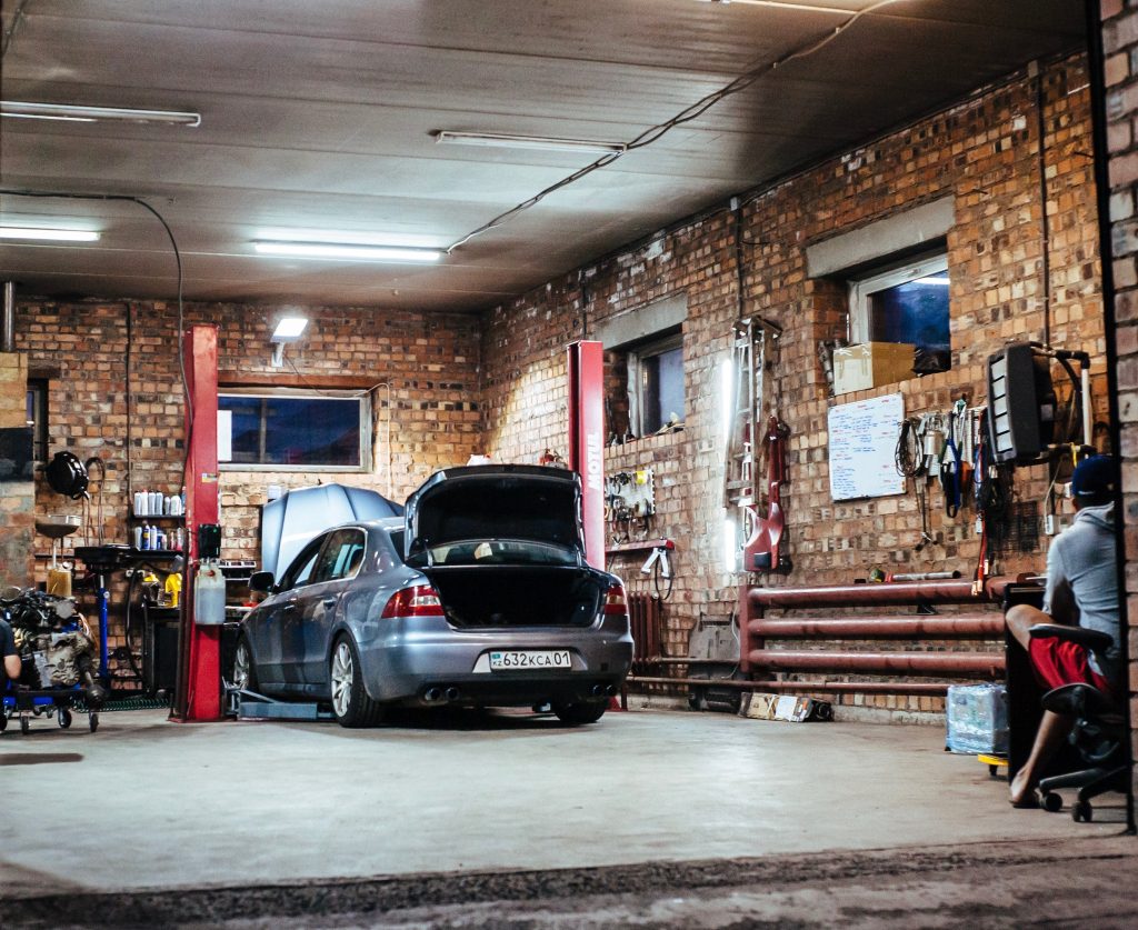 Garage containing tools and a car